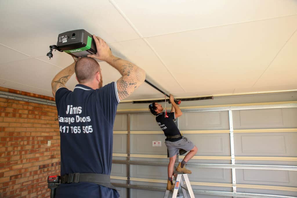 Jims workers installing a garage door in Perth